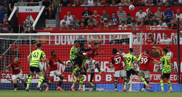 MANCHESTER, ENGLAND - MAY 12: Andre Onana of Manchester United in action with Gabriel of Arsenal during the Premier League match between Manchester United and Arsenal FC at Old Trafford on May 12, 2024 in Manchester, England. (Photo by Matthew Peters/Manchester United via Getty Images)