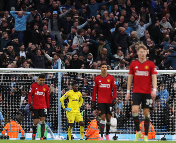 MANCHESTER, ENGLAND - MARCH 03: Andre Onana of Manchester United reacts to conceding a goal to Phil Foden of Manchester City during the Premier League match between Manchester City and Manchester United at Etihad Stadium on March 03, 2024 in Manchester, England. (Photo by Matthew Peters/Manchester United via Getty Images)