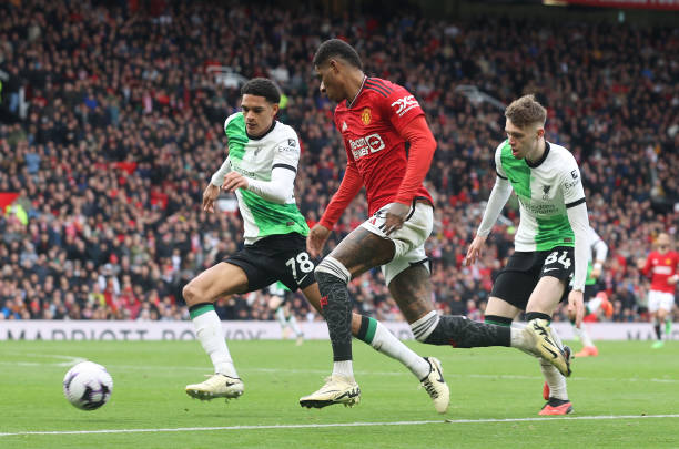 MANCHESTER, ENGLAND - APRIL 07: Marcus Rashford of Manchester United in action with Jarell Quansah of Liverpool during the Premier League match between Manchester United and Liverpool FC at Old Trafford on April 07, 2024 in Manchester, England. (Photo by Matthew Peters/Manchester United via Getty Images)