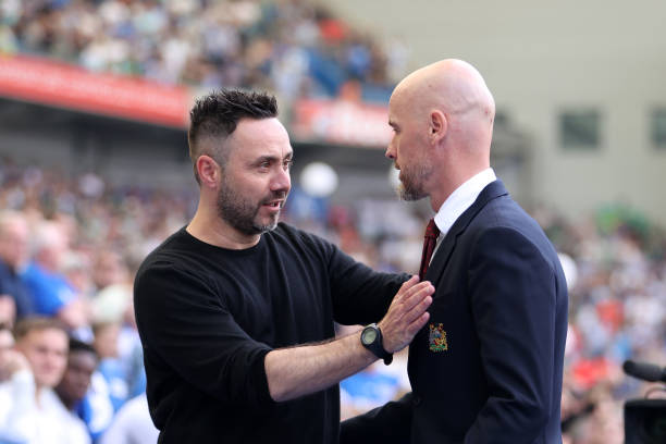 BRIGHTON, ENGLAND - MAY 19: Roberto De Zerbi, Manager of Brighton & Hove Albion, and Erik ten Hag, Manager of Manchester United, embrace prior to the Premier League match between Brighton & Hove Albion and Manchester United at American Express Community Stadium on May 19, 2024 in Brighton, England. (Photo by Michael Steele/Getty Images)