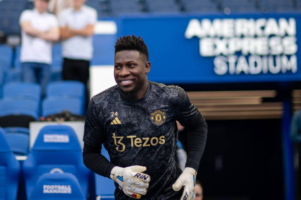 BRIGHTON, ENGLAND - MAY 19: Andre Onana of Manchester United warms up ahead of the Premier League match between Brighton & Hove Albion and Manchester United at American Express Community Stadium on May 19, 2024 in Brighton, England. (Photo by Ash Donelon/Manchester United via Getty Images)