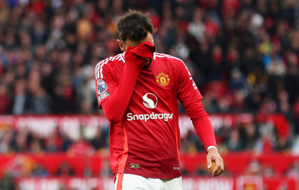 MANCHESTER, ENGLAND - SEPTEMBER 29: Bruno Fernandes of Manchester United, reacts as he leaves the pitch after being shown a red card during the Premier League match between Manchester United FC and Tottenham Hotspur FC at Old Trafford on September 29, 2024 in Manchester, England. (Photo by Carl Recine/Getty Images)